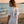 Lobster Stamp tee worn at golden hour on a Mediterranean beach
